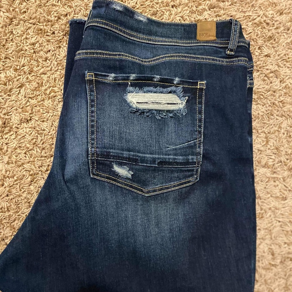 Buckle skinny distress jeans